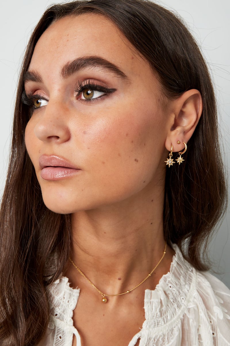 Oorbellen ster met steentjes - Goud kleur/wit