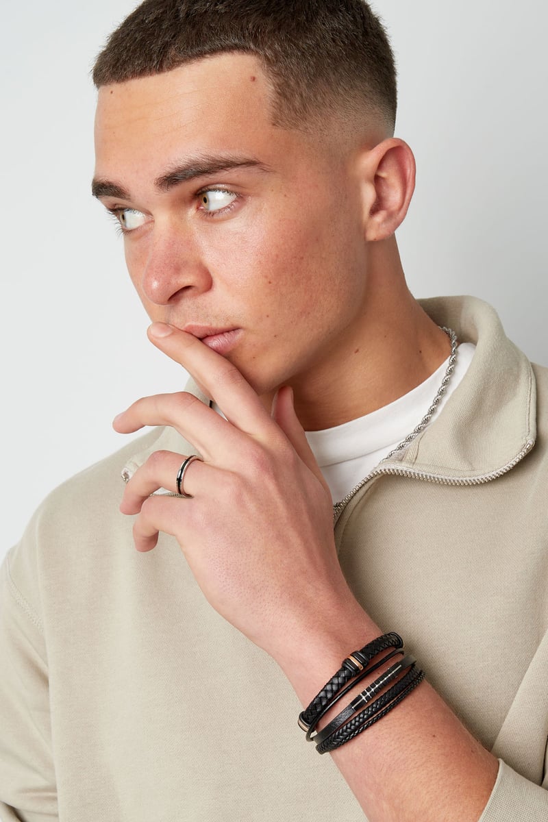 Mannenarmband gevlochten met goude/zwarte ringen - zwart