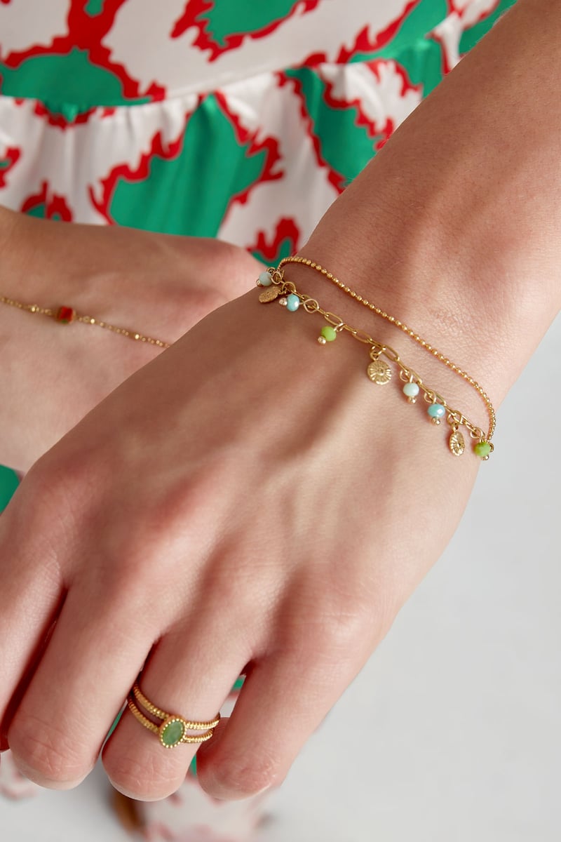 Armband met muntjes en kralen - roze/Goud kleur 