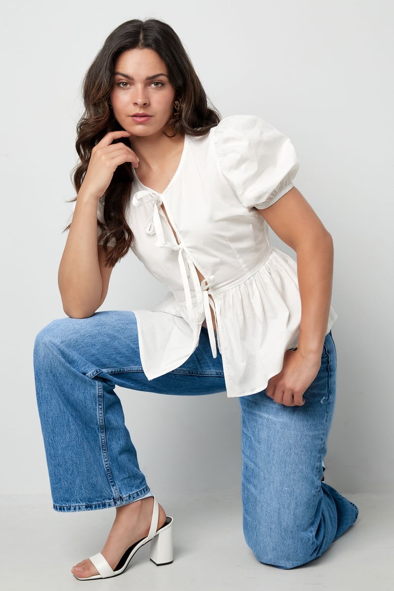Musthave peplum blouse met strikjes - zwart