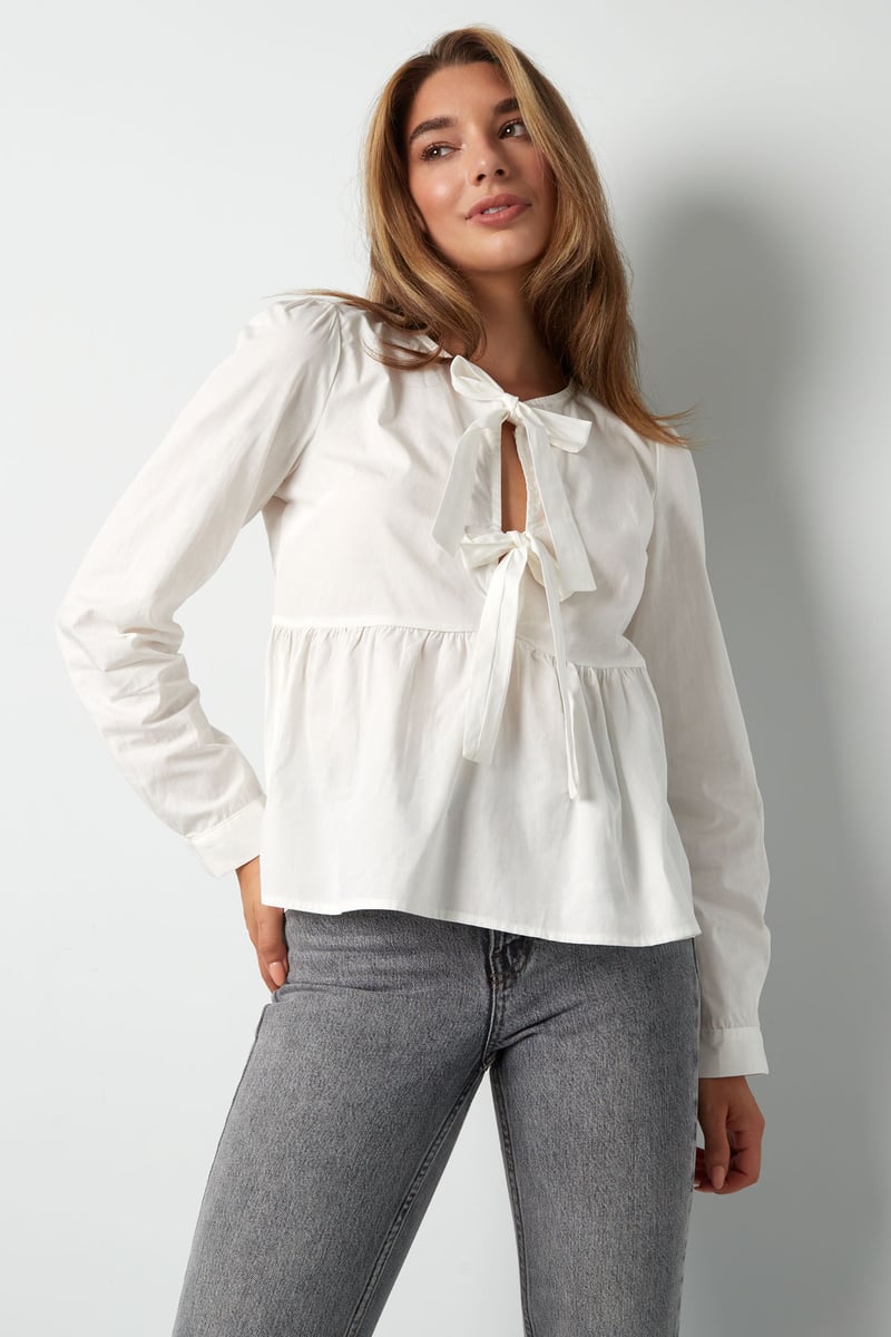 Longsleeve peplum top met strikjes - beige