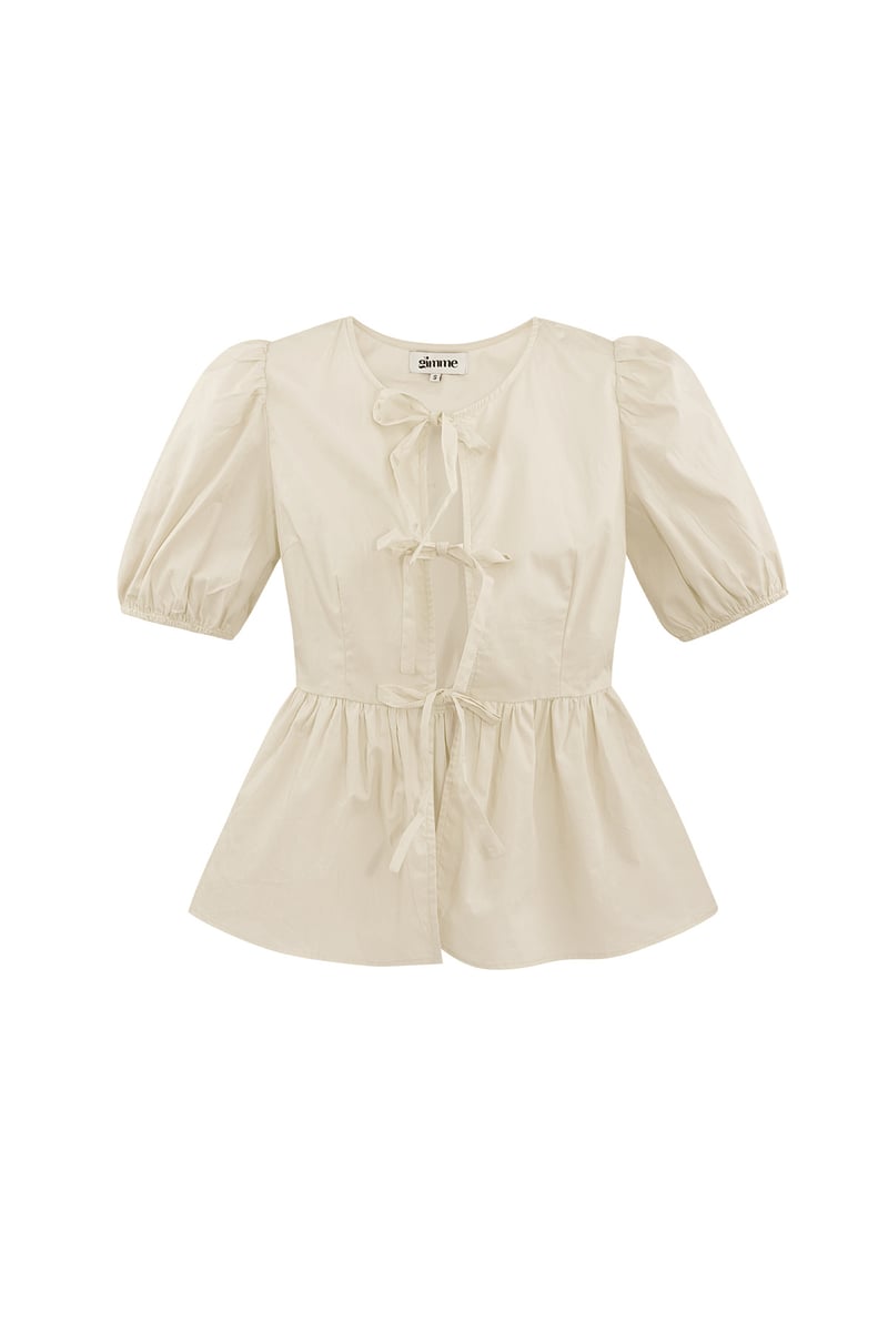 Musthave peplum blouse met strikjes - zwart